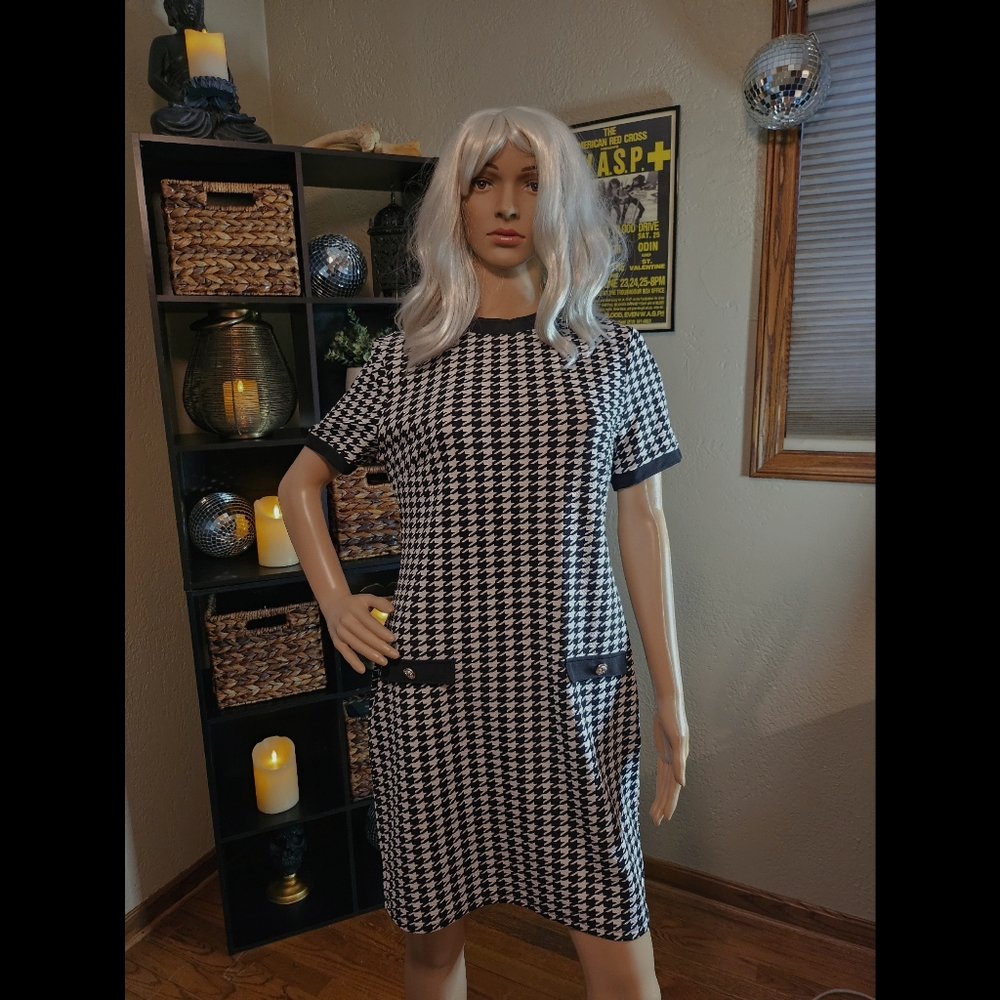 Black and white patterned dress with gold button